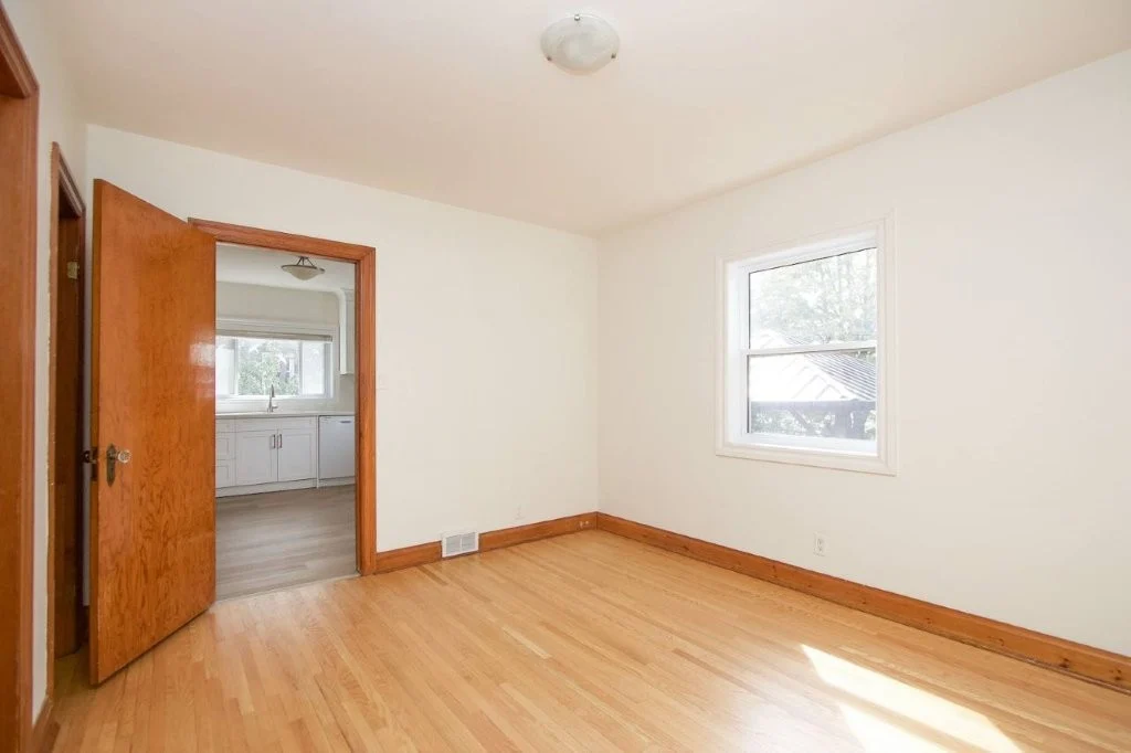 Refinished hardwood and original bedroom door