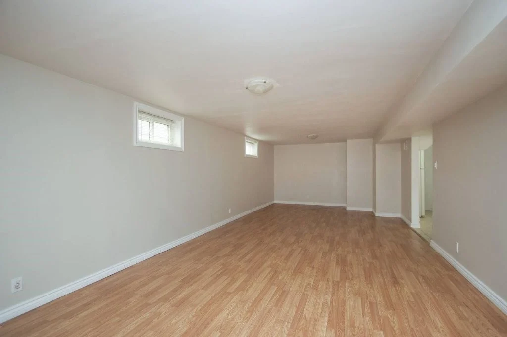 Large recreation room with laminate flooring