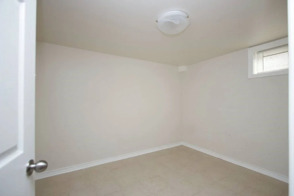 Lower-level bedroom with above-grade window