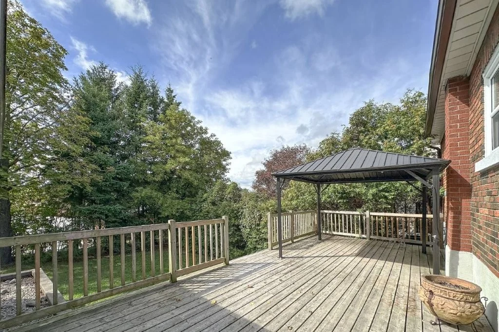 Rear deck with gazebo and mature trees